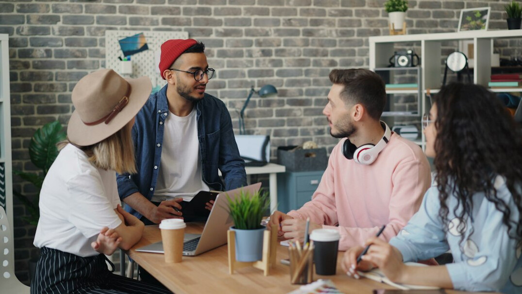 diverse group of young adults talking